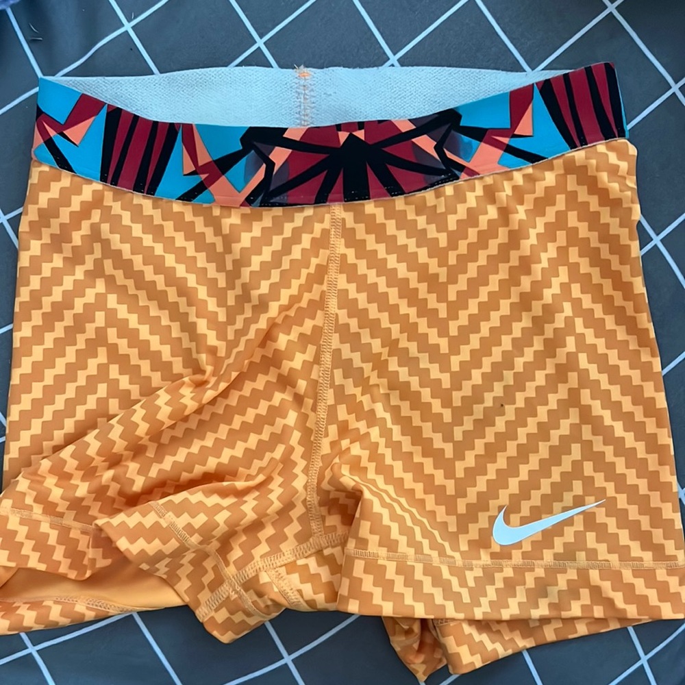 Orange women nike pro shorts